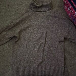 A turtleneck sweater never worn